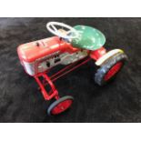 A Tri-ang pedal tractor C1960s having highly detailed plastic body. Measuring 70cm in length.