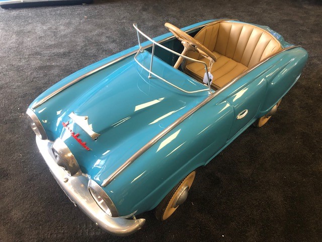 A rare Mosconica pedal car C1960s. Finely detailed metal body measuring 112cm in length.