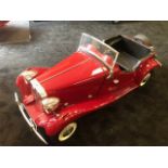 A Touchwood MG TD pedal car C1980s. Finely detailed fibreglass body measuring 126cm in length.