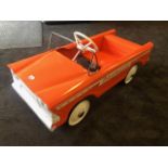 A 'new' Tri-ang Bermuda pedal car C1960s. Finely detailed metal body measuring 87cm in length.