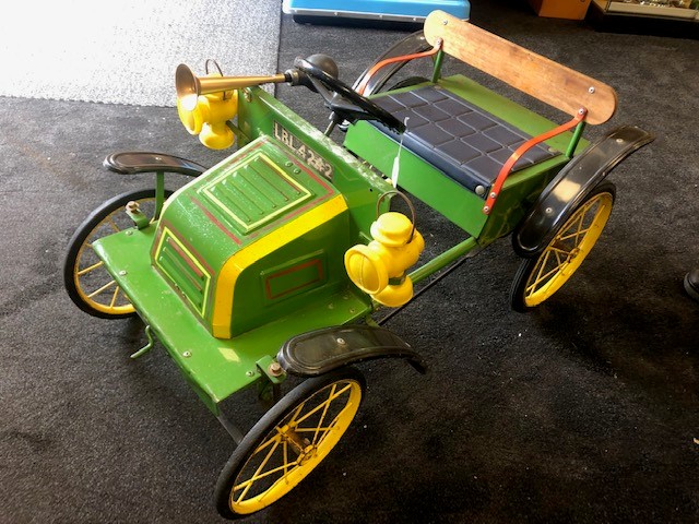 A Tri-ang De Dion Bouton pedal car C1960s. Finely detailed metal body measuring 90cm in length.