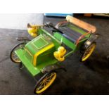 A Tri-ang De Dion Bouton pedal car C1960s. Finely detailed metal body measuring 90cm in length.