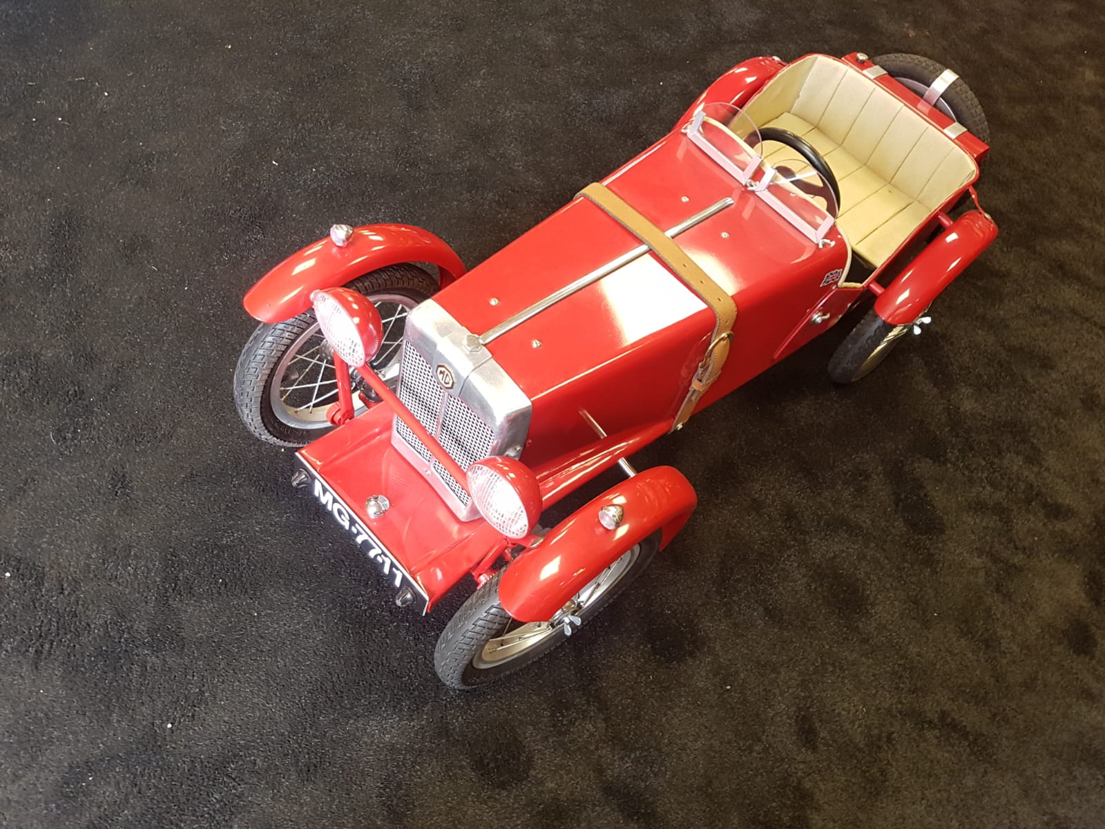 An MG, T C Pedal Car C1970s having highly detailed metal body. Measuring 115cm in length.