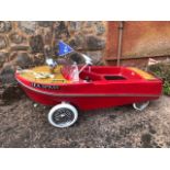 A Tri-ang Sea Spray pedal car (boat) C 1960s. Red plastic body complete with pennants.