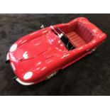 A rare French-made E-Type Jaguar pedal car C1960s having highly detailed plastic body.