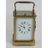 A five glass brass carriage clock having swing handle over,
