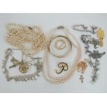 A quantity of costume jewellery including faux pearls, enamelled bangle,