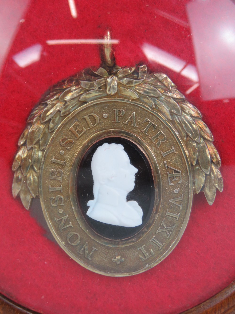 A silver gilt oval Pitt Club badge,