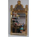 A large contemporary Continental type gilt effect pier mirror, measuring 125 x 65cm.