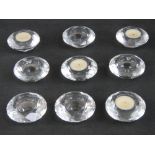 A set of nine crystal glass tealight holders.