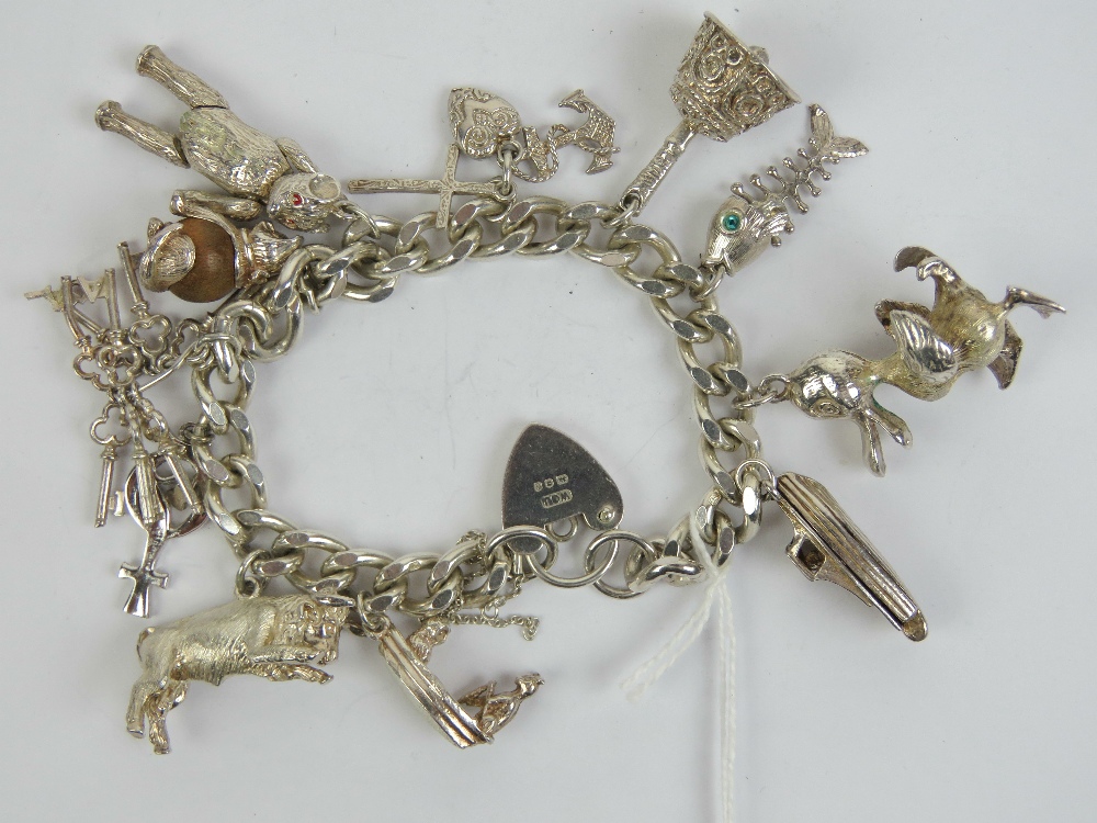 A HM silver charm bracelet having heart padlock clasp hallmarked for Birmingham,