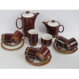 A Poole Pottery tea set comprising hot water pot, tea pot, milk jug, sugar bowl,
