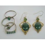 Three silver and malachite rings, together with a pair of malachite drop earrings.