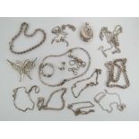 A quantity of silver jewellery including a butterfly brooch, a locket, a pair of earrings,