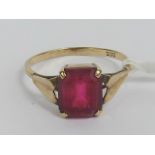 A vintage 9ct gold ring having large central octagonal red paste stone, size M, 2.3g.