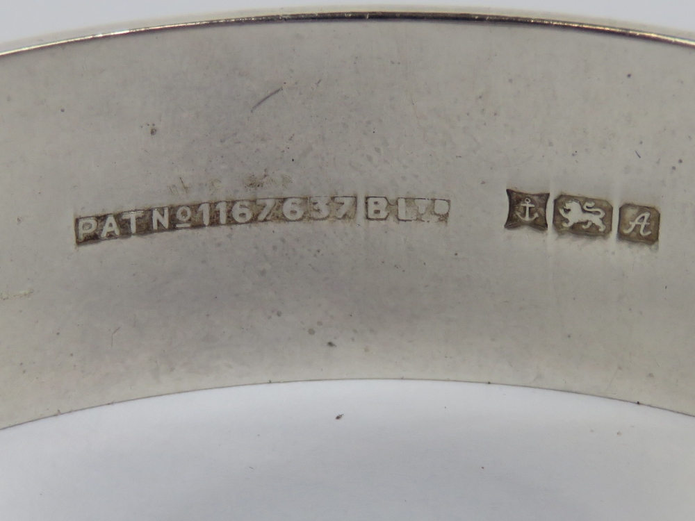 A HM silver bangle having engraved vine and leaf pattern to front, hallmarked Birmingham 1975. - Image 2 of 2