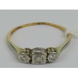 A vintage 18ct gold platinum and three stone diamond ring,