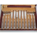 A boxed set of six silver handled fish knives and forks.