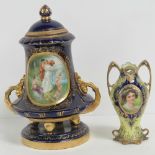 A hand painted and gilded double handled short vase featuring the hand painted face of a female