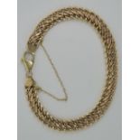 A 9ct gold infinity link bracelet complete with safety chain, hallmarked 375, 8.6g.