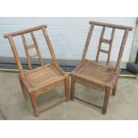 A pair of early 20th century Oriental hardwood childs chairs each with solid seat,