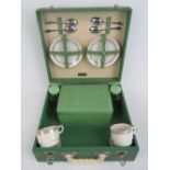 An original Brexton picnic case c1960s with original tin food box, twin glass jars,