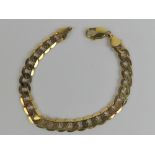 A heavy 9ct gold flattened curb link bracelet,