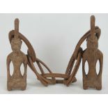 A 20th century carved wood African marriage symbol comprising male and female forms united by