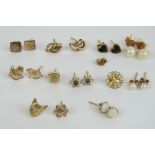 Eight pairs of 9ct gold and yellow metal stud earrings, together with four single earrings.