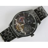 A Louise Cottier automatic Dual Time 'Phantom' wristwatch in black stainless steel having skeleton