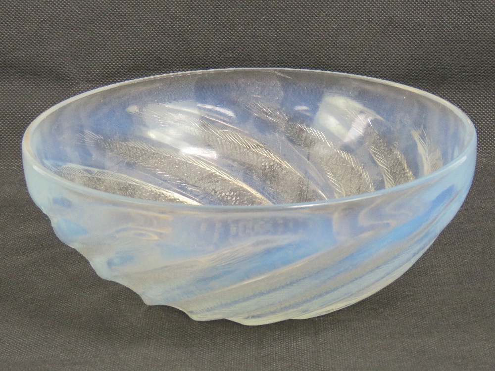 René Lalique (French, 1860-1945); an opalescent Poissons bowl,