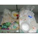 A large quantity of assorted glassware including vases, decanter, bowls, etc.