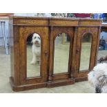 A smart inlaid Victorian credenza in walnut having three arched top mirror panels to the front,