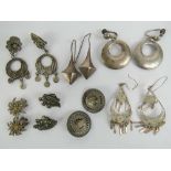 A quantity of silver and white metal earrings including sterling silver discs with screw backs,