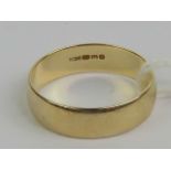A 9ct gold band hallmarked 375, size N, 2.3g.
