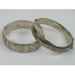 Two HM silver hinged bangles each having floral engraving to front, each approx 6cm internal dia,
