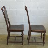 A good pair of Victorian high back oak framed chairs having embossed leather and studded decoration