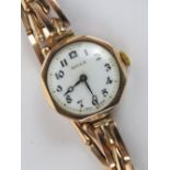 A 9ct gold ladies Rolex wristwatch on 9ct gold expanding bracelet,