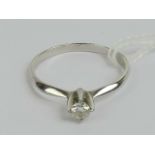 An 18ct white gold and diamond solitaire ring,