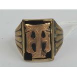 A vintage 9ct gold and onyx gentlemans signet ring having applied rose metal 'TH' upon, stamped 9ct,