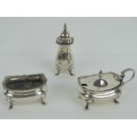 A HM silver cruet set comprising salt, pepperette and mustard pot, liners deficient,