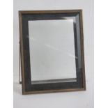 A vintage silver plated photograph frame having bevelled glass to front and glass back,