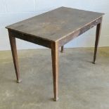 An early 20th century pine table raised over straight cut legs, replacement plywood top a/f,