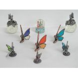 A quantity of fairy themed ornaments including two paperweights, a snow globe,
