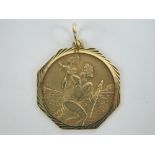 A 9ct gold St Christopher pendant of octagonal form, hallmarked 375, 2.5cm dia at widest points, 3.
