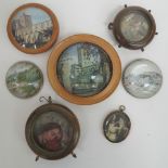 Four glass paperweights, two within wooden mounts, depicting Buckfast Abbey,