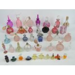 A large quantity of assorted contemporary glass perfume bottles.