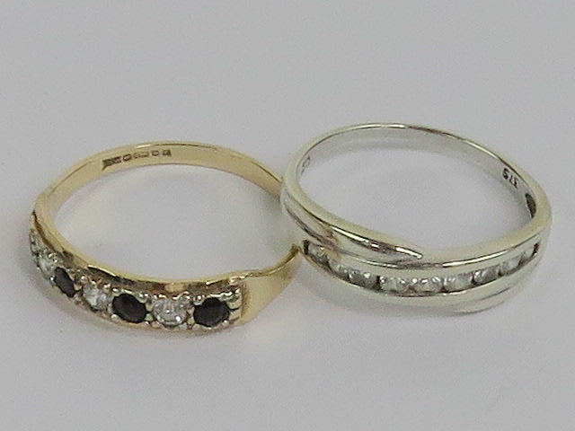 A 9ct white gold and cz ring size N, together with a 9ct gold cz half eternity ring, hallmarked 375,