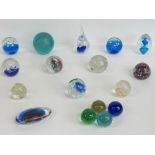 A quantity of assorted art glass paperweights and baubles in blues, whites and greens.