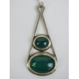 A large HM silver green onyx pendant having two graduated oval cabachons on an open frame,
